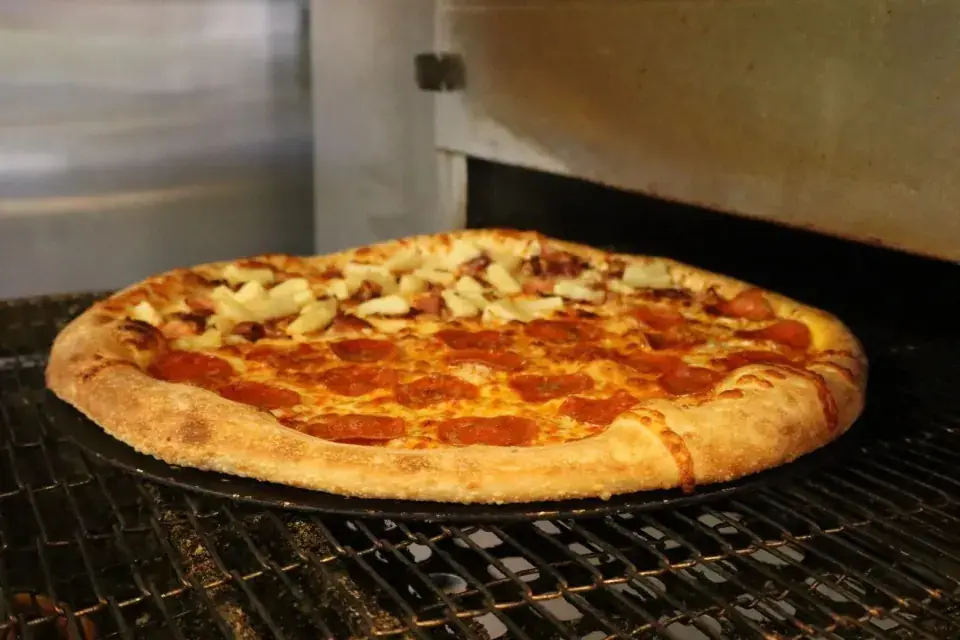 Freshly baked pizza at 83 Pizza